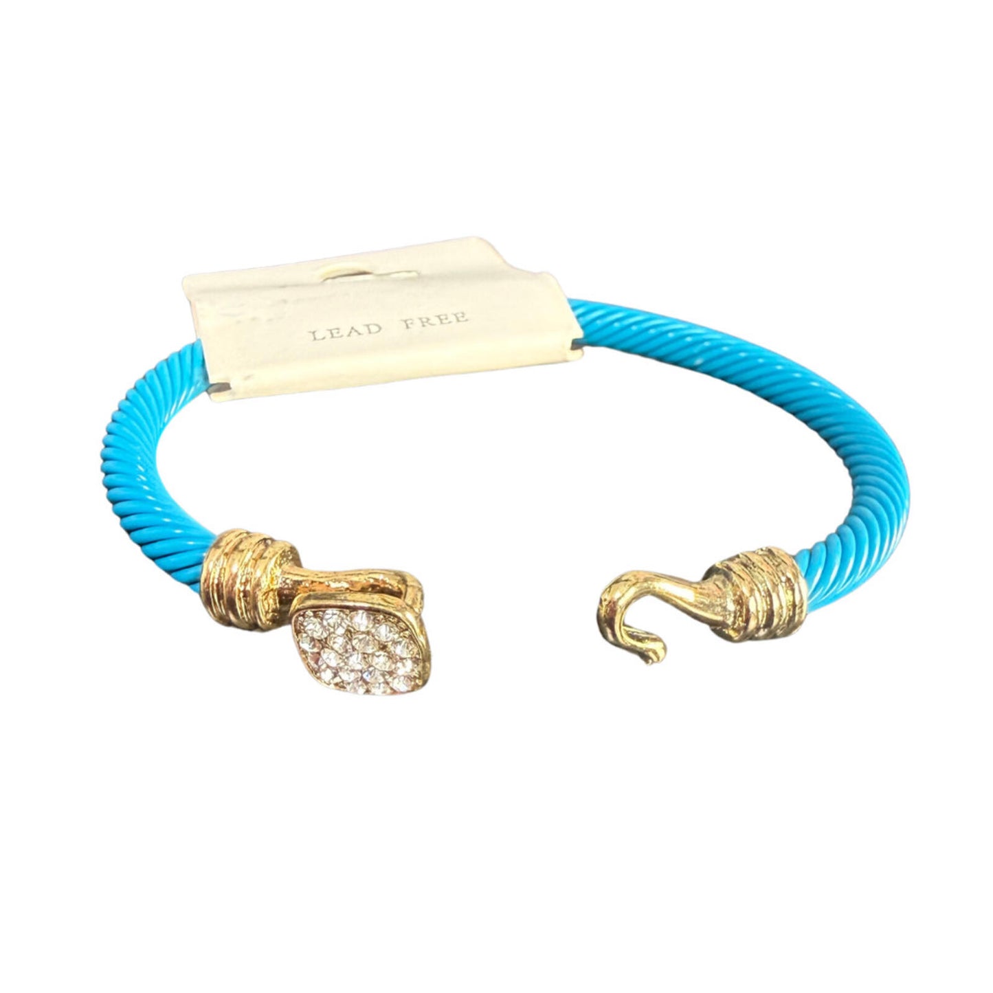 Blue cable cuff bracelet with gold accents and a crystal‑decorated end.